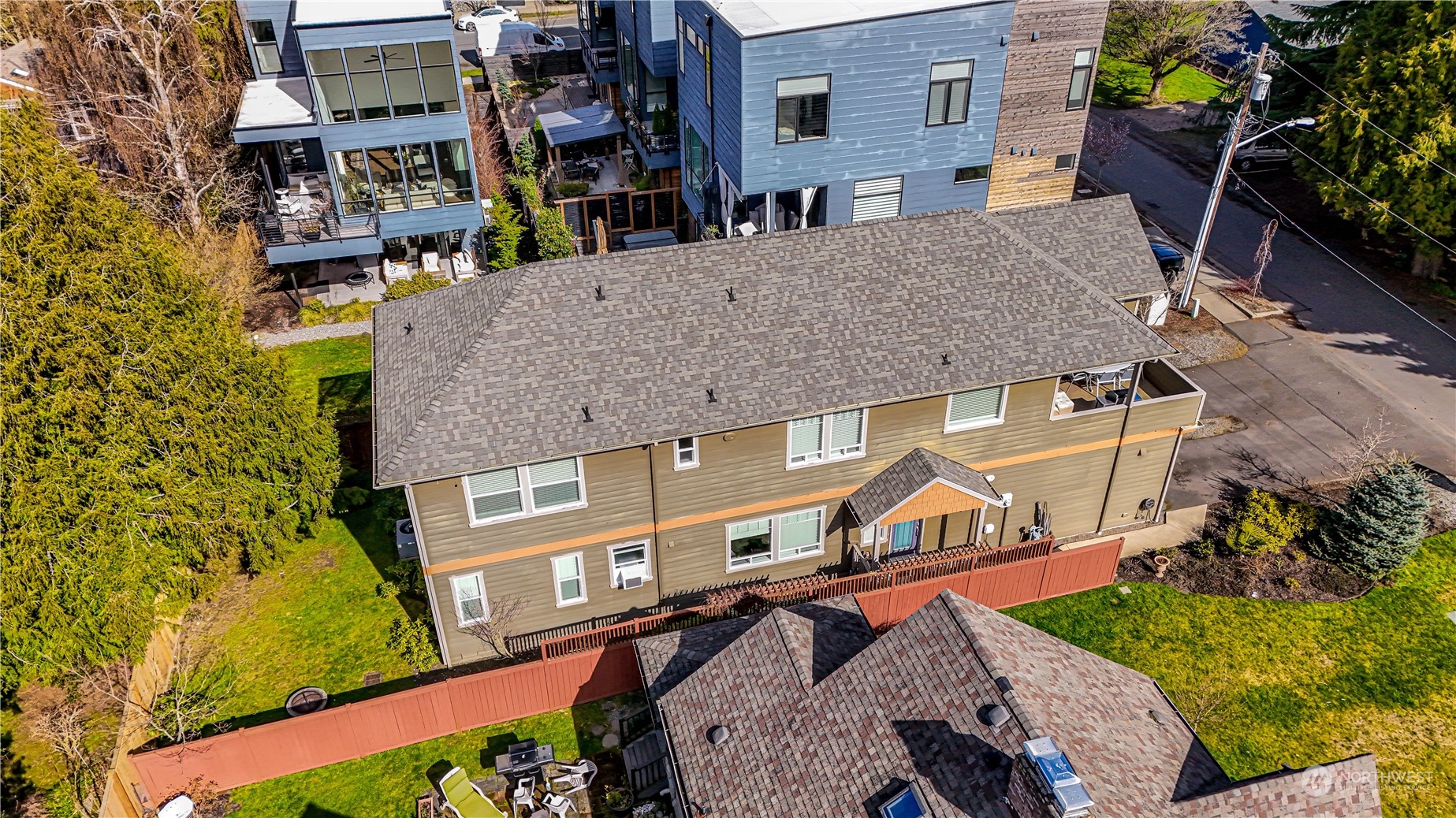 an aerial view of a house with a yard