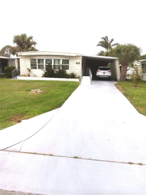 a view of house with outdoor space and yard