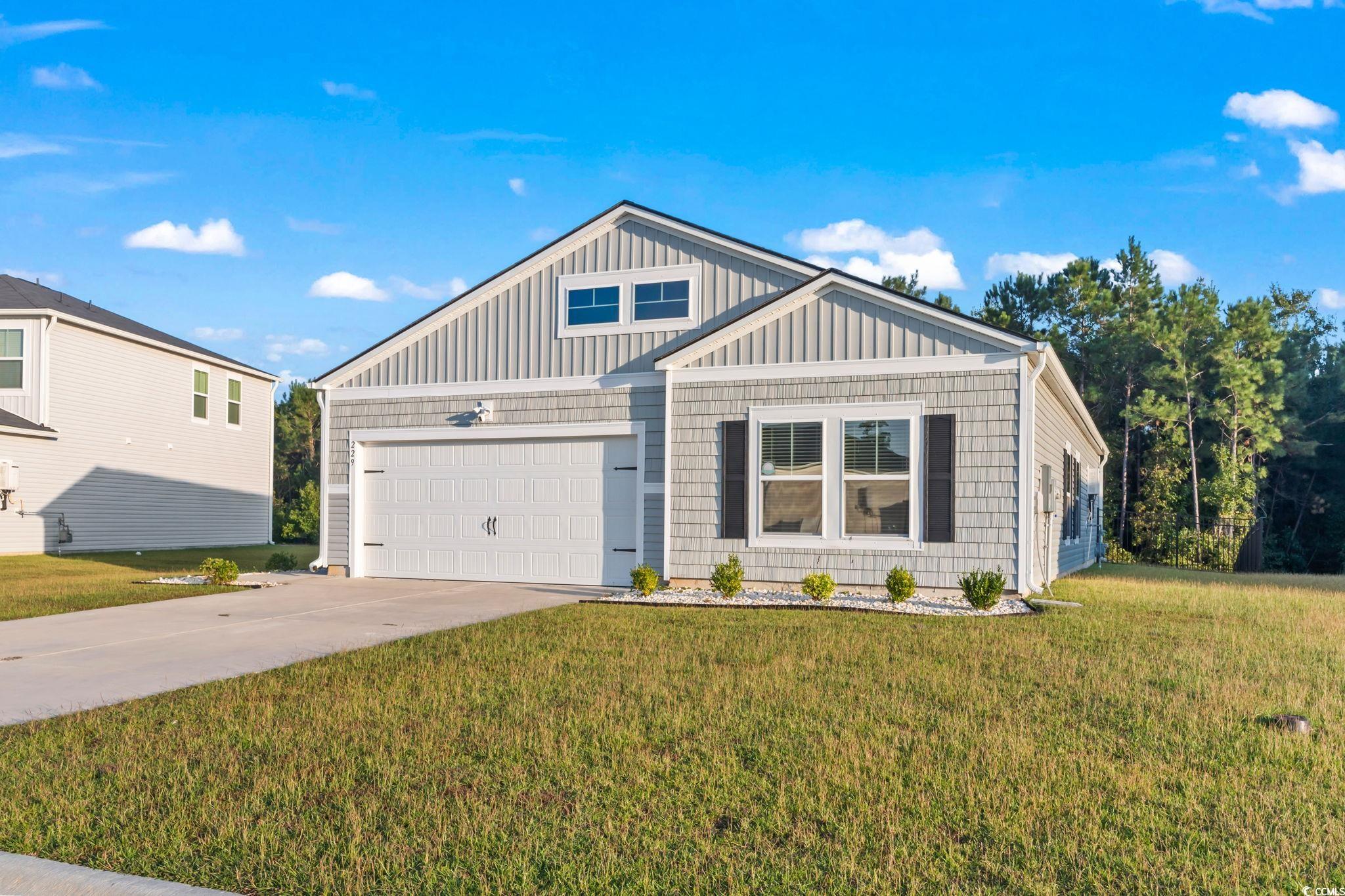 View of front of property featuring a front yard