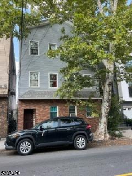 a car parked in front of a house