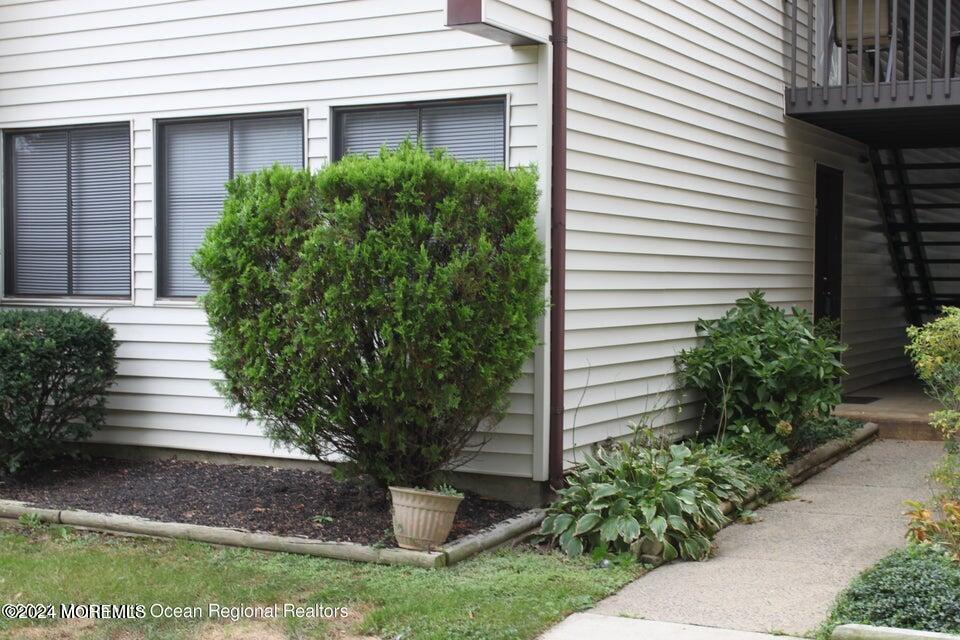 a view of a house with potted plants