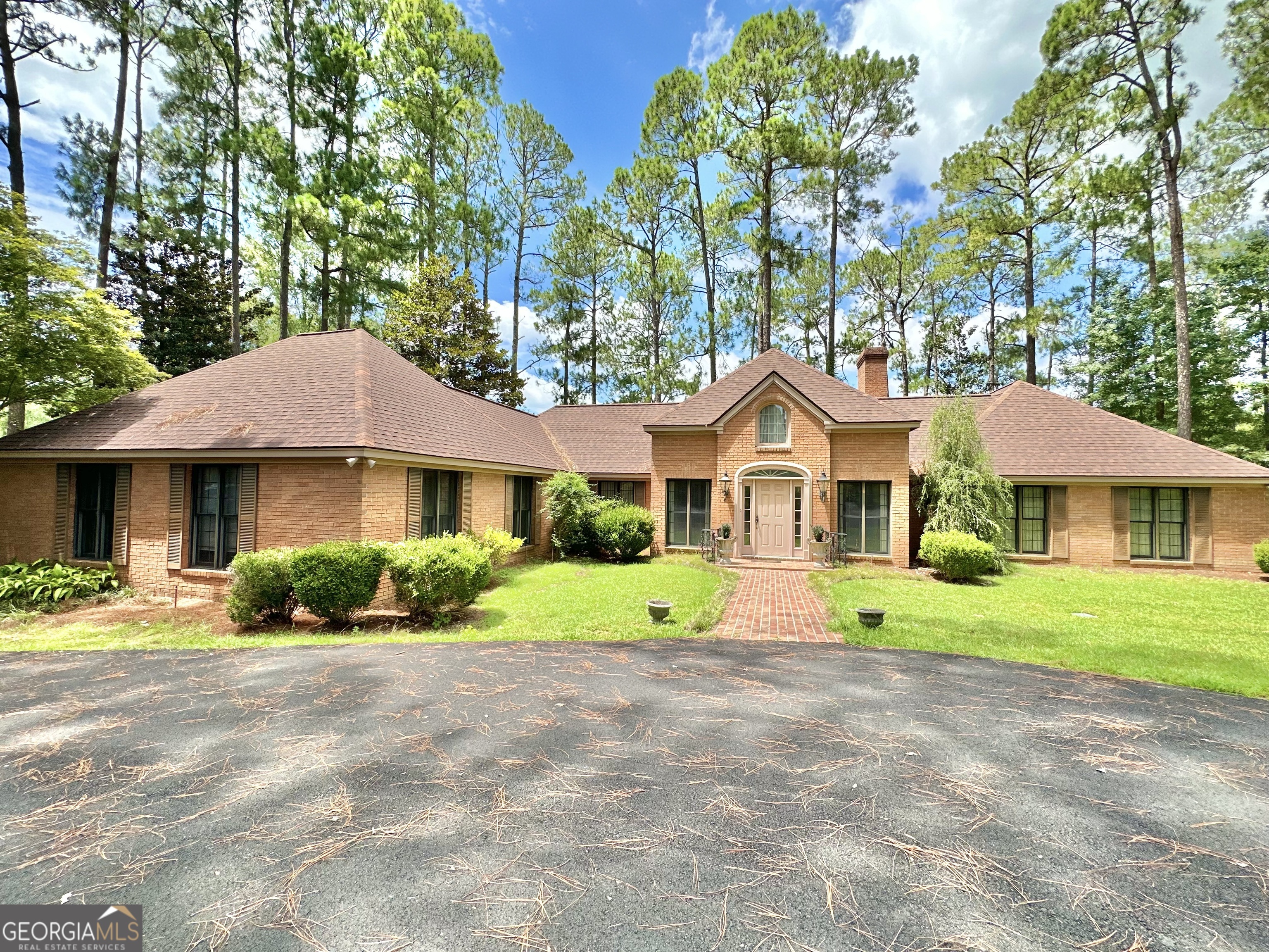 a front view of a house with a yard and porch