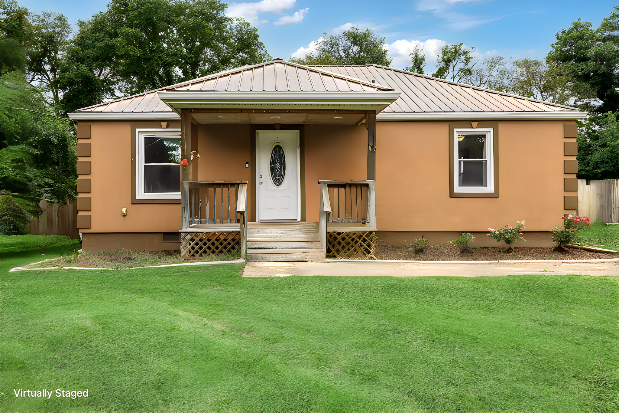 a view of a house with a yard and sitting area