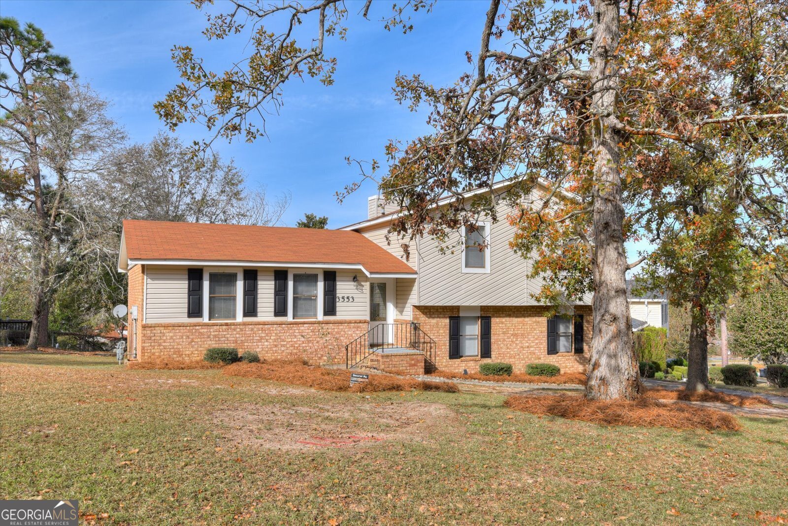 a front view of a house with a yard