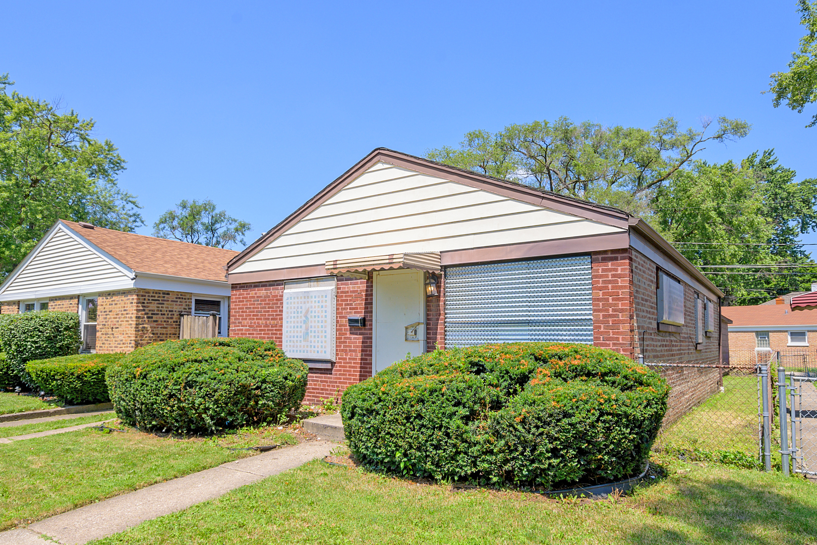 front view of a house with a yard