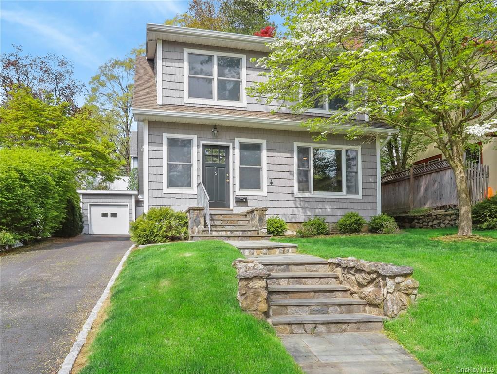 front view of a house with a yard