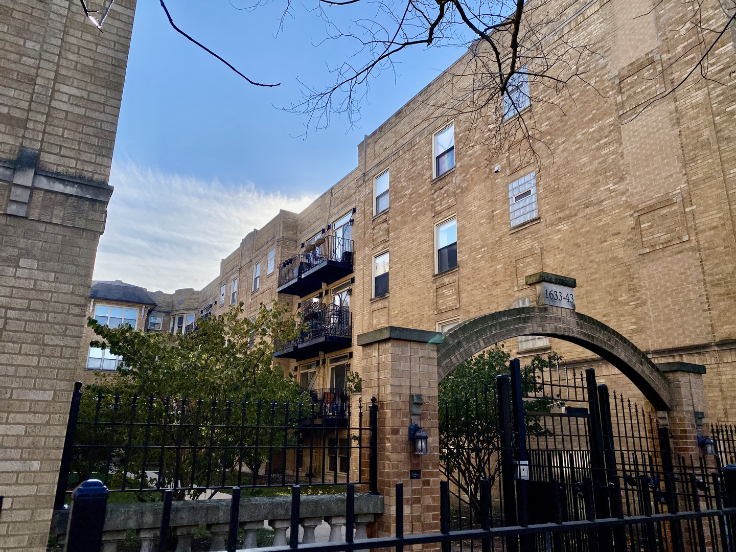 a view of a brick building with many windows