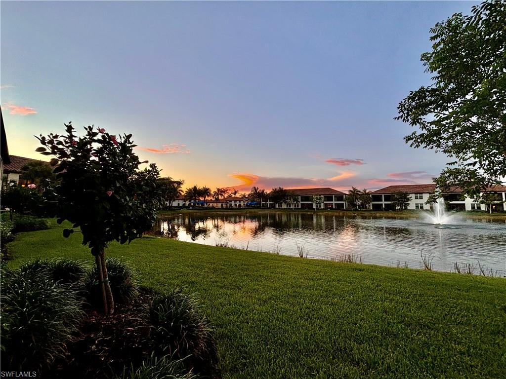 a view of a lake with houses in outdoor space