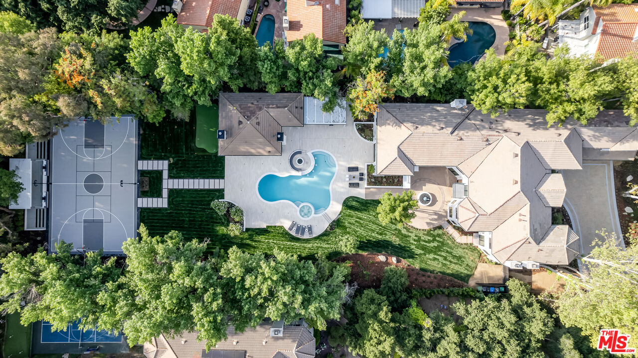 an aerial view of residential house with outdoor space and parking