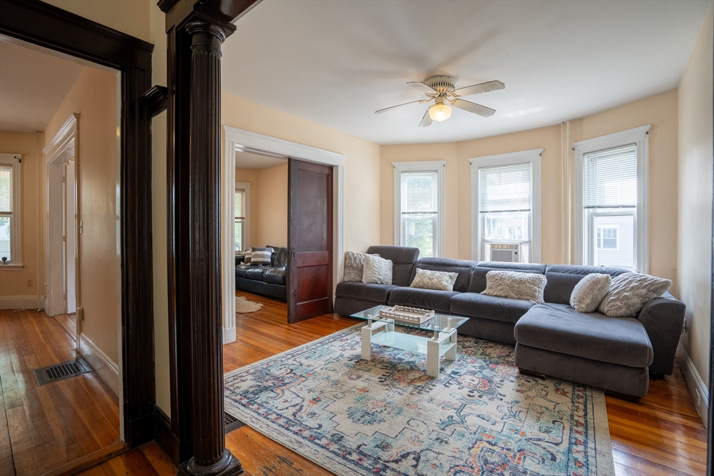 a living room with furniture and a rug