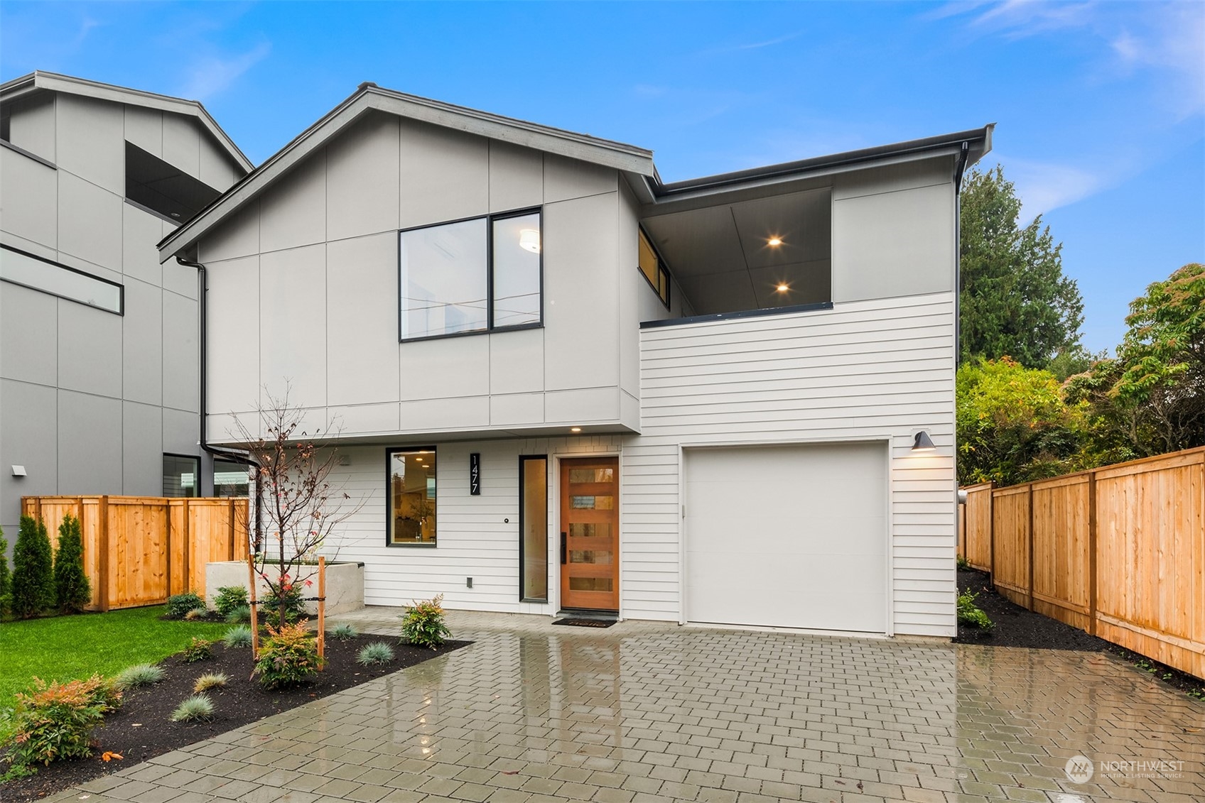 a front view of a house with garage