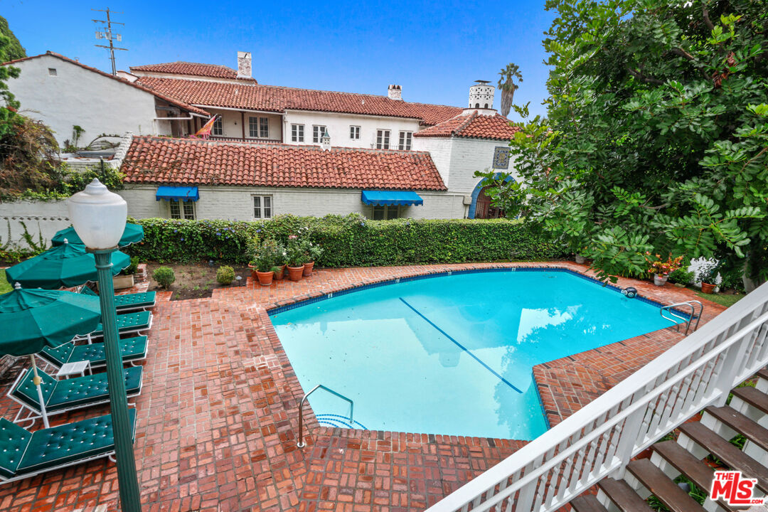 a view of a swimming pool with a patio