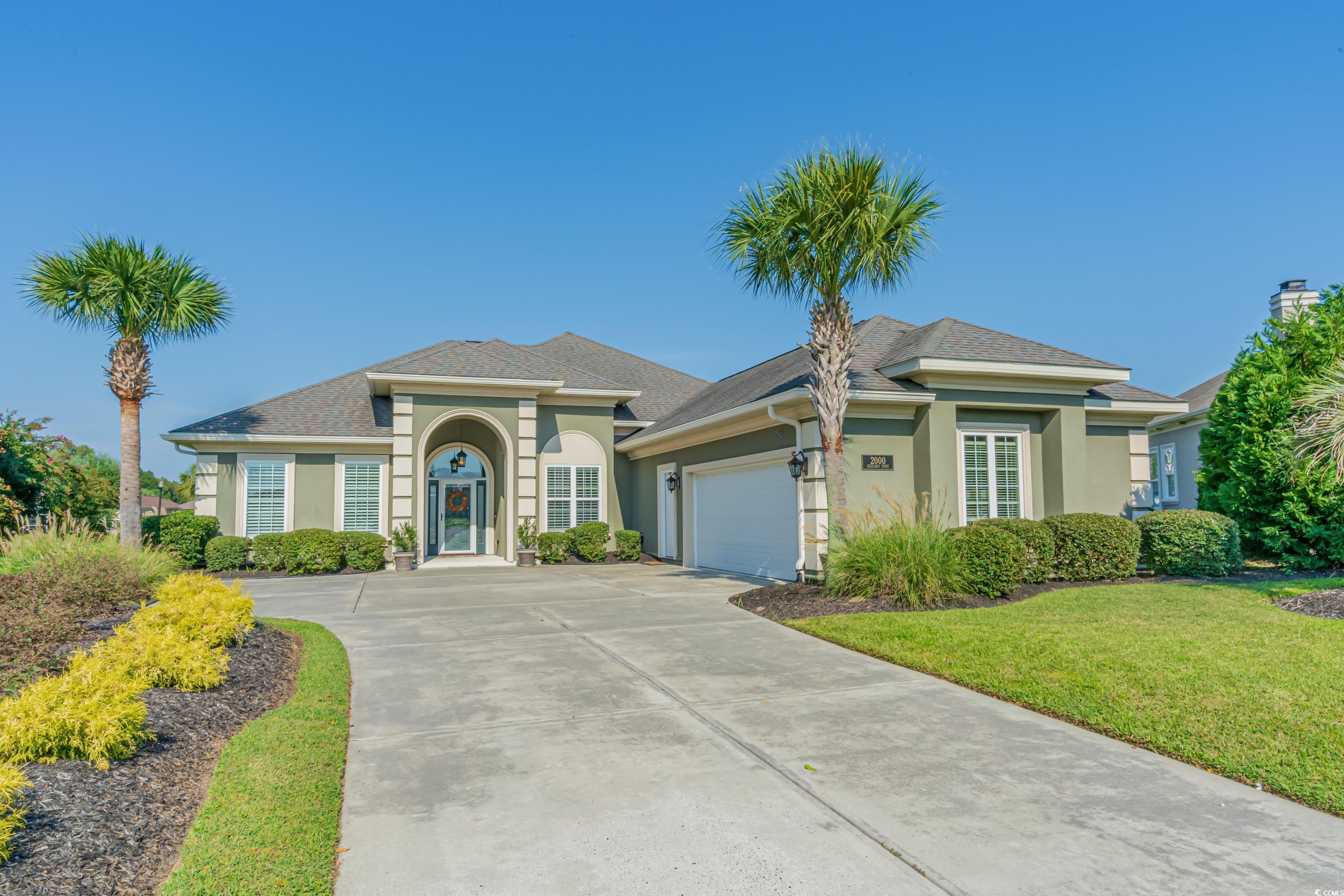 MATURE LANDSCAPING SURROUNDS THE HOME.