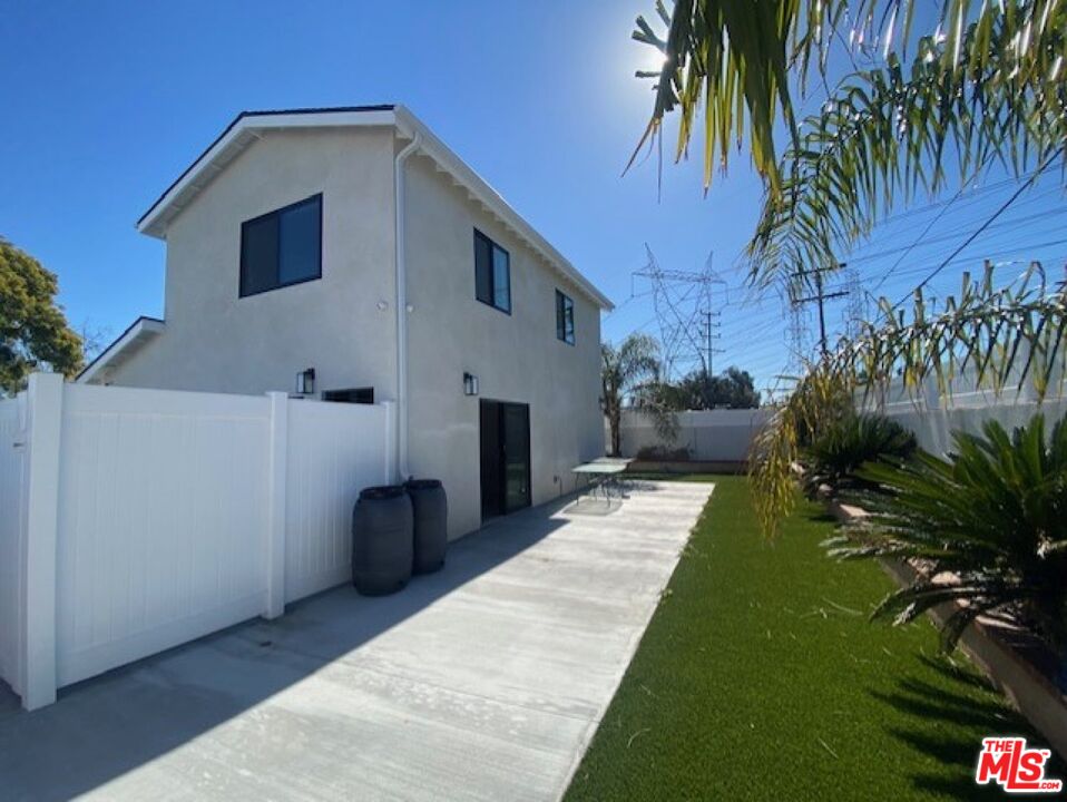 a backyard of a house with seating space