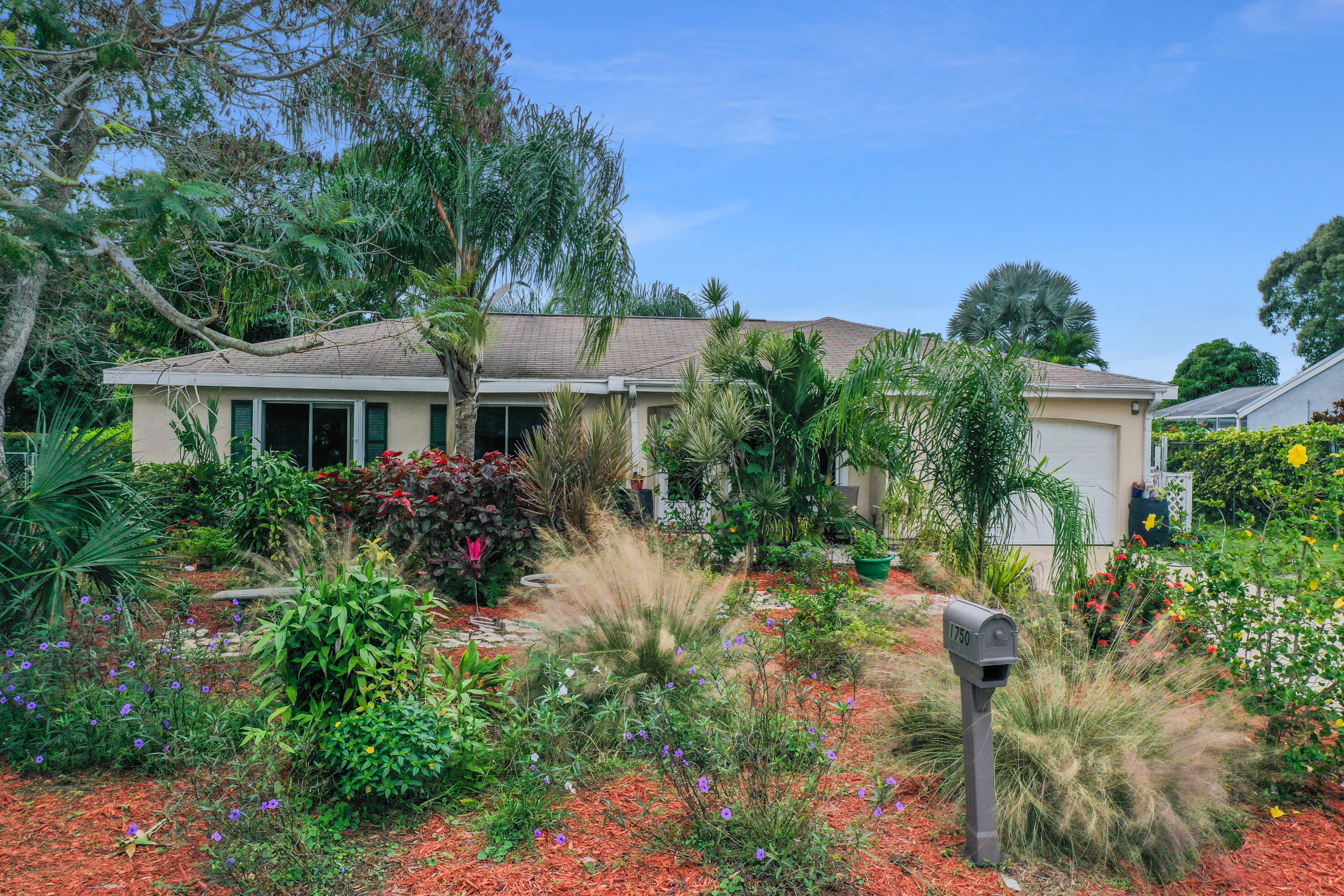 front view of a house with a garden