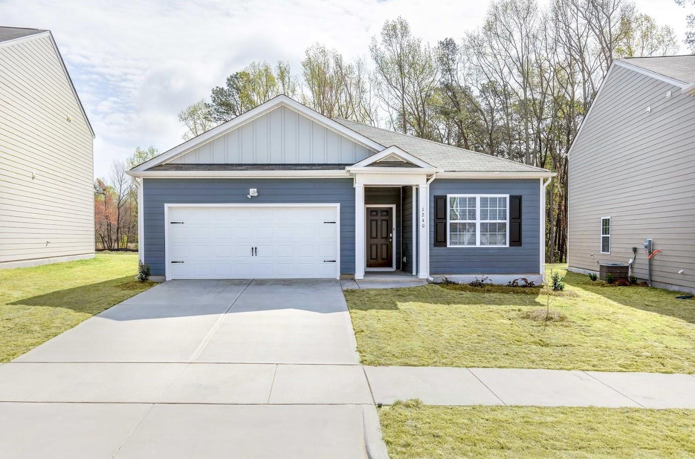 front view of a house with a yard