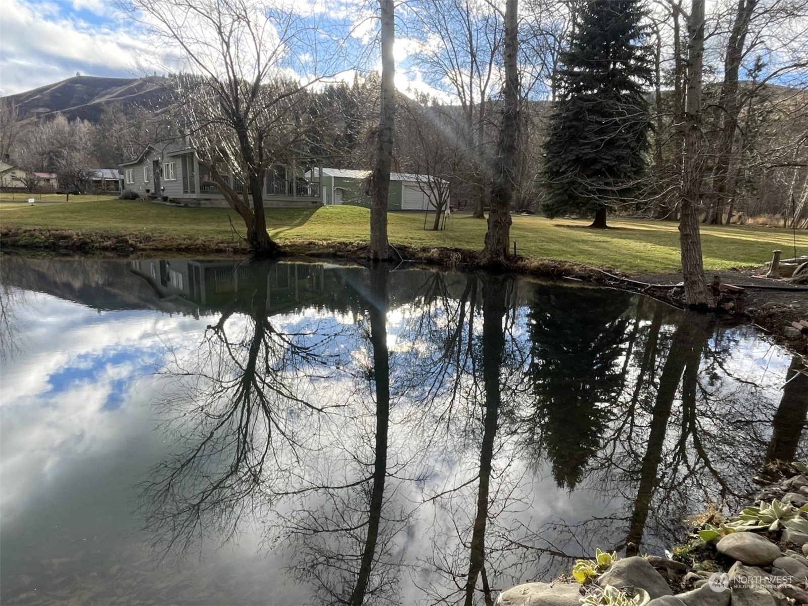 a view of a lake with a yard