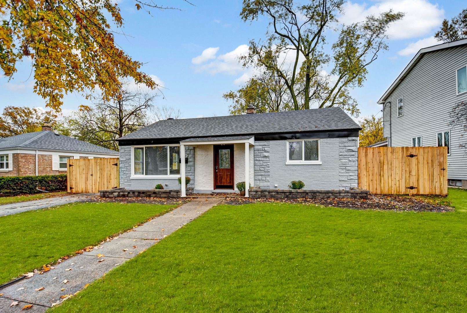 a front view of a house with a yard