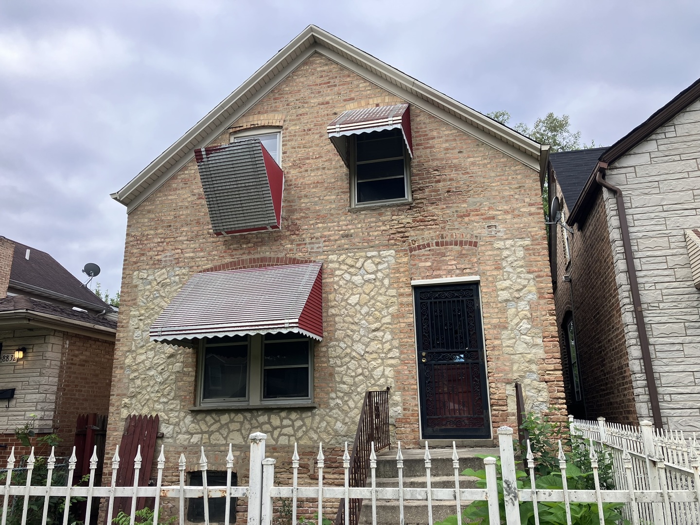 a front view of a house with glass windows