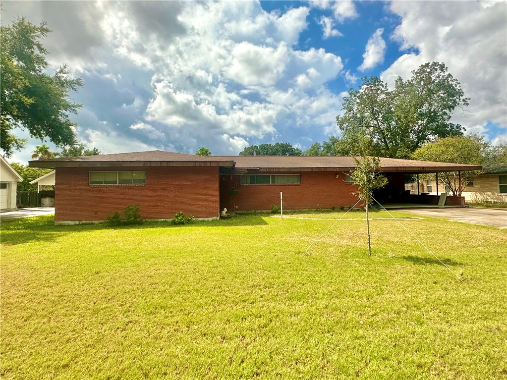 a house view with swimming pool in front of it