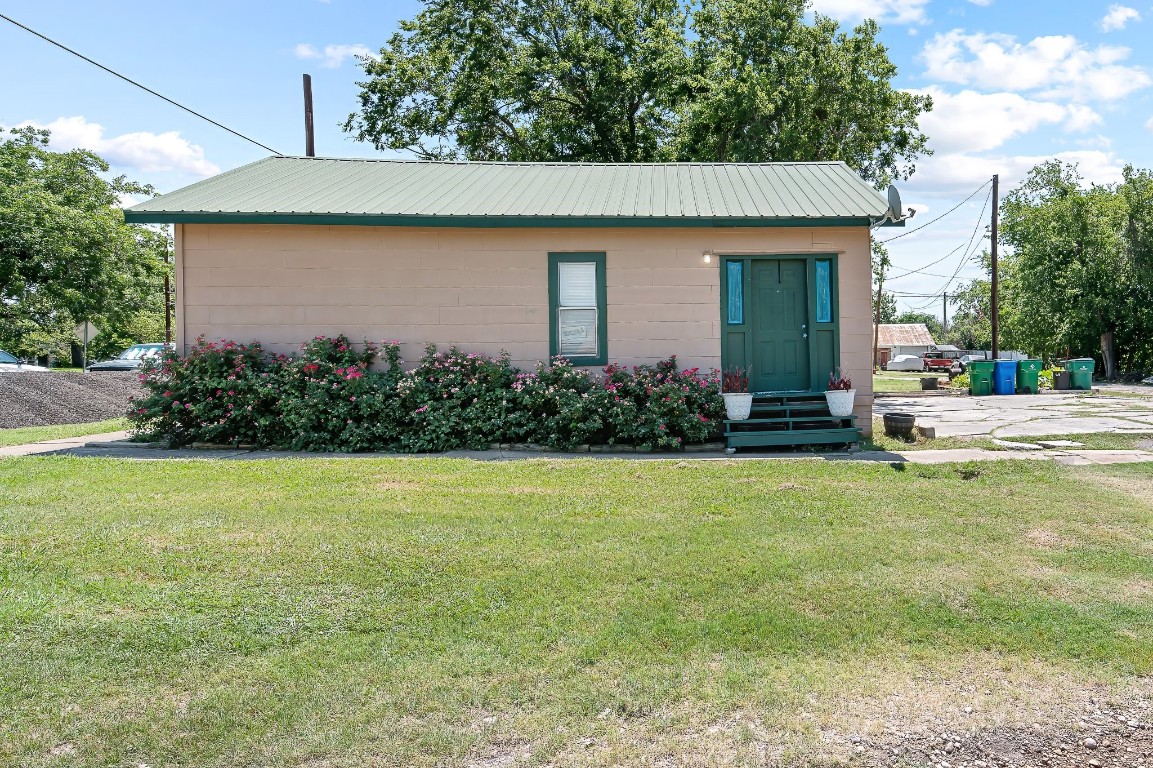 a front view of house with garden