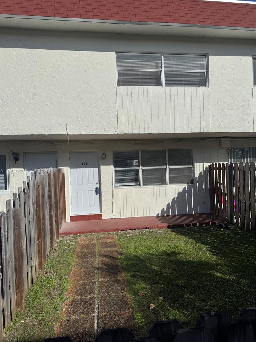 a house with garden in front of it