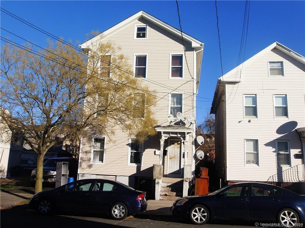 a front view of a house with parking