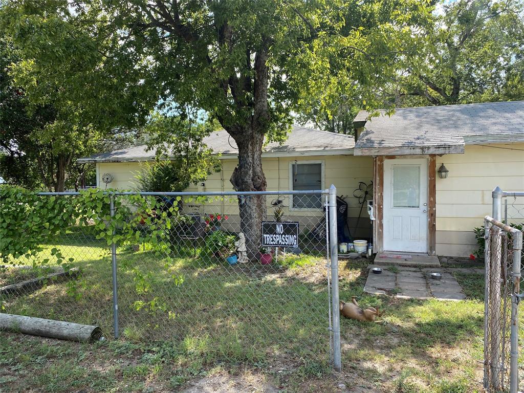 a view of a house with backyard porch and sitting area