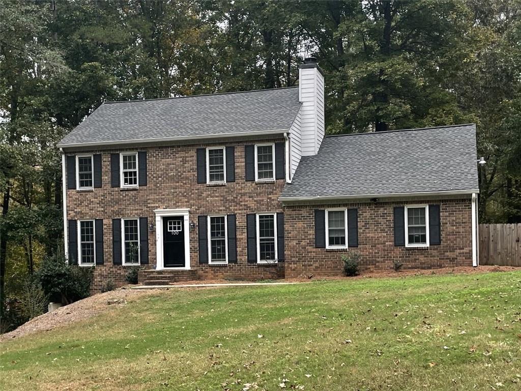 front view of a house with a yard