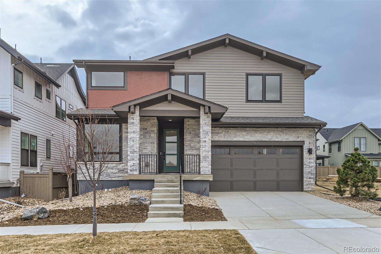 a front view of a house with garage