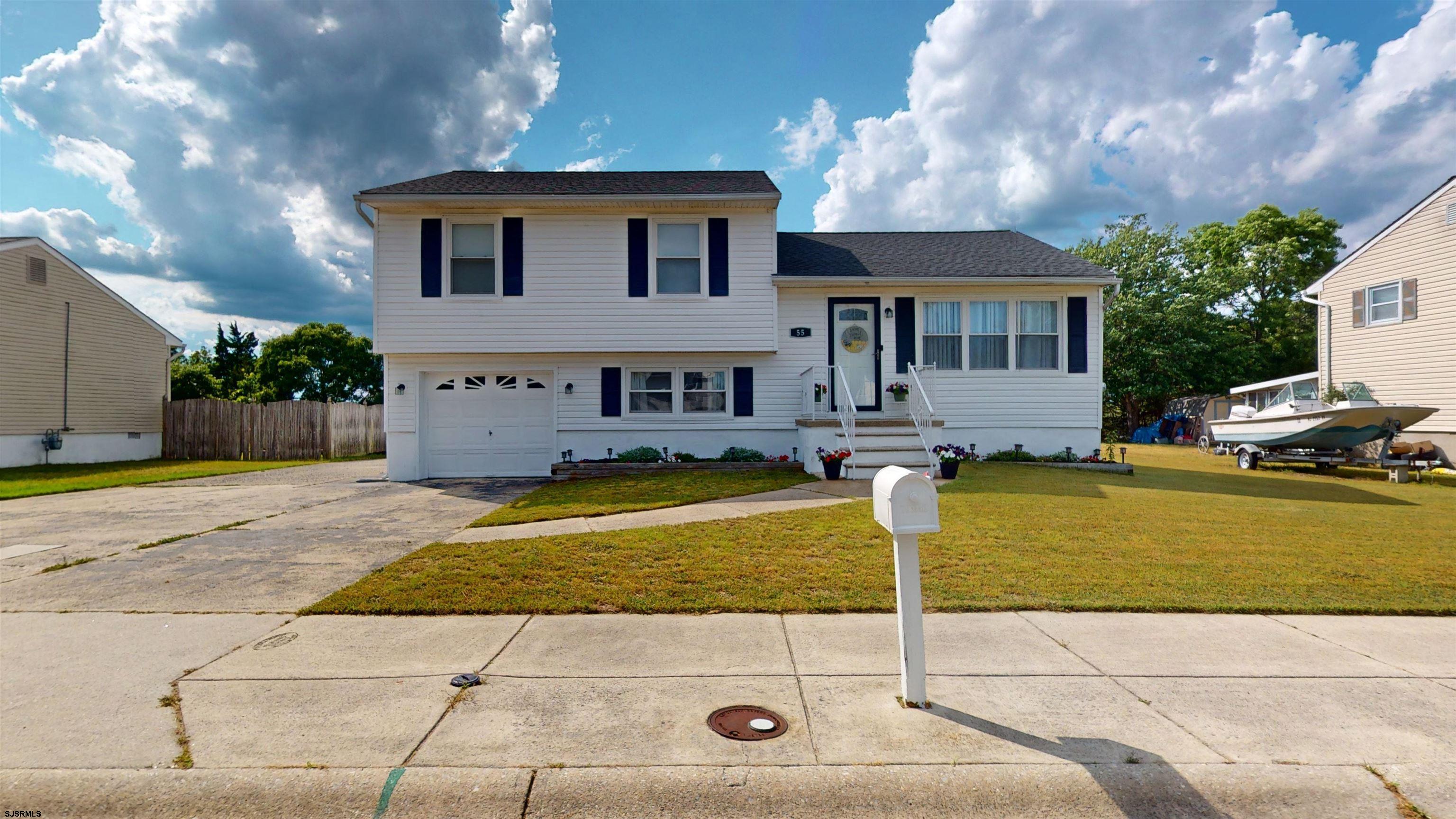 a front view of a house with swimming pool