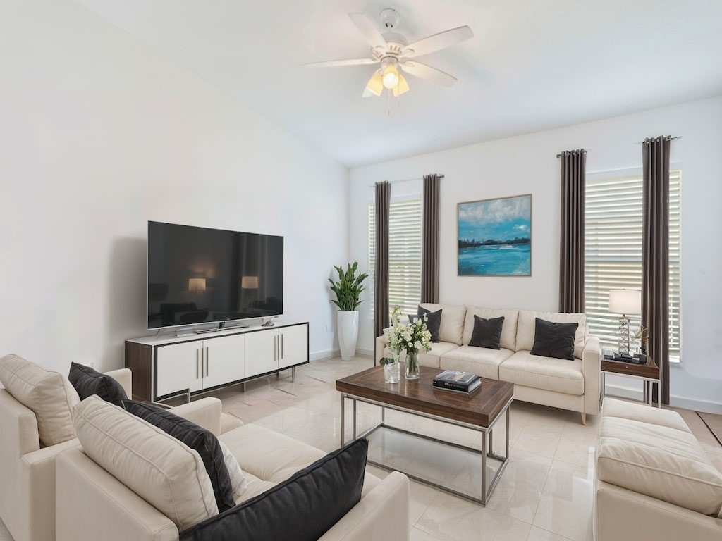 a living room with furniture and a flat screen tv