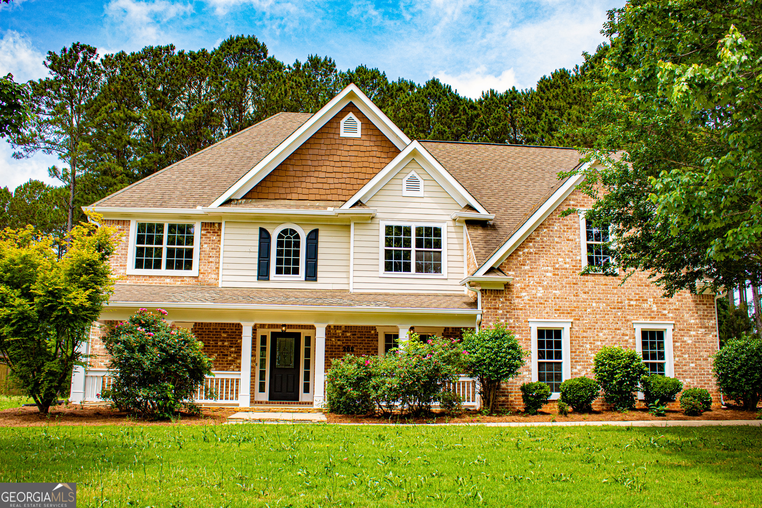 a front view of a house with a yard