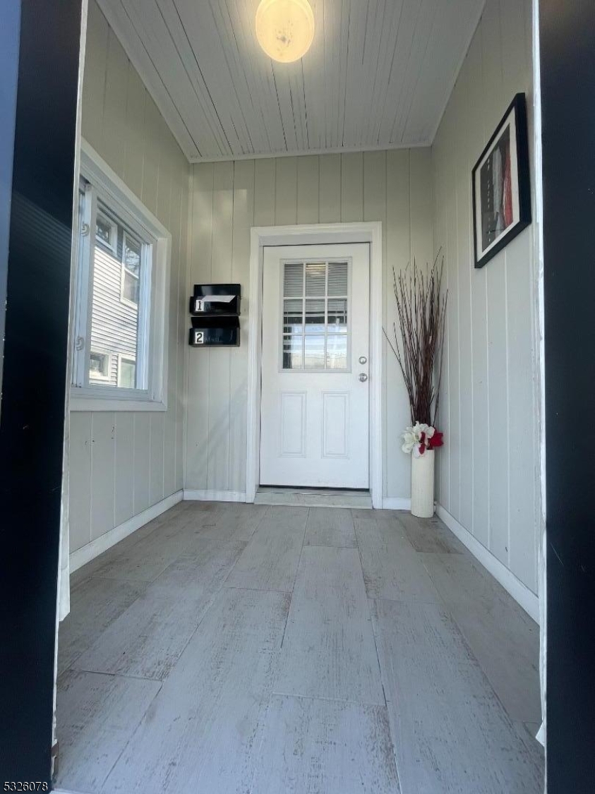 an empty room with windows and closet