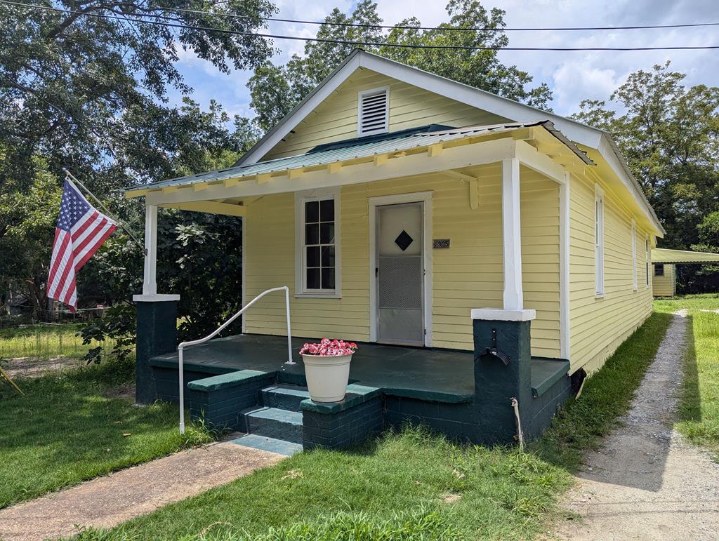 a front view of house with garden