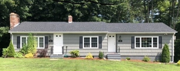 a front view of a house with a yard