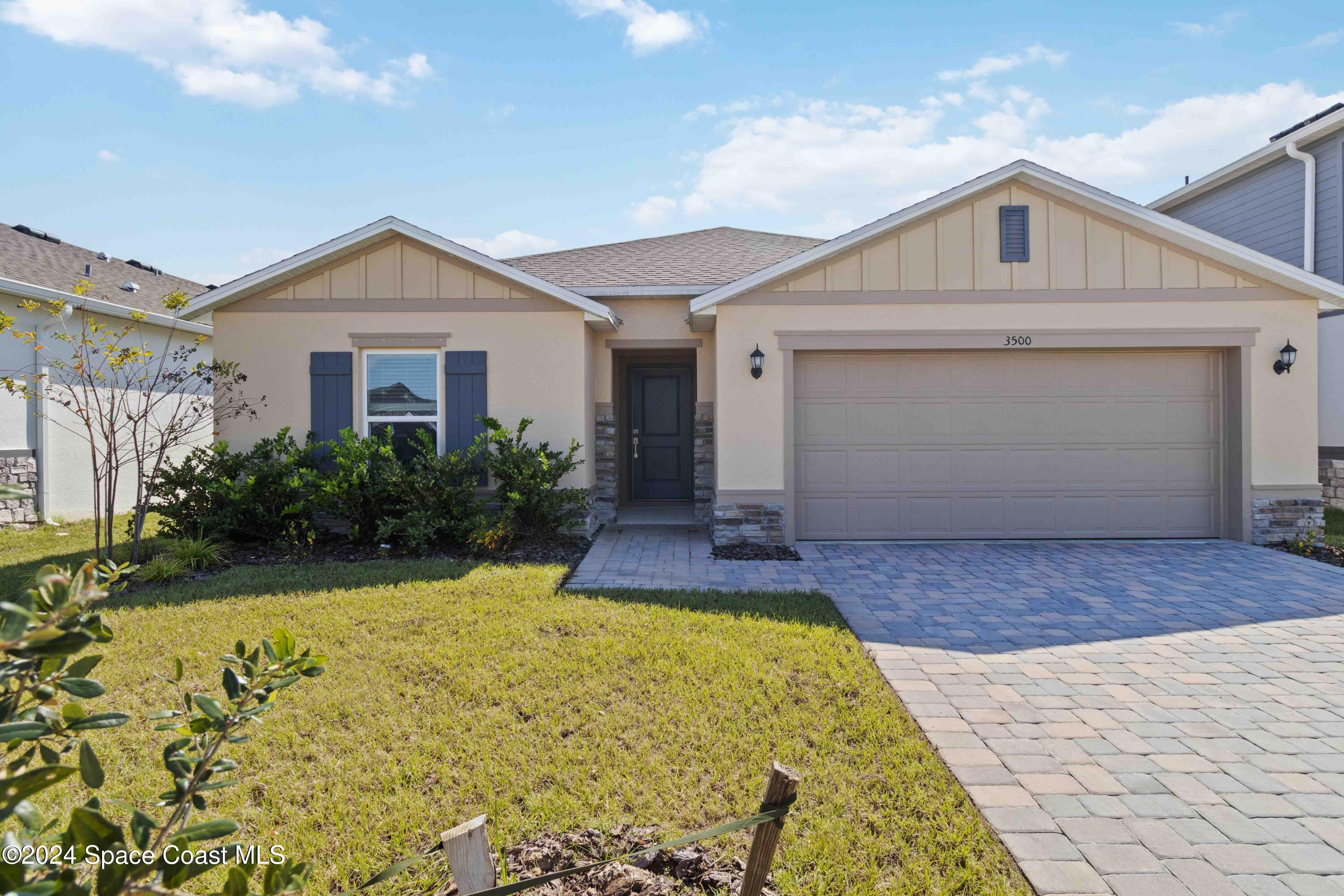 a front view of a house with yard