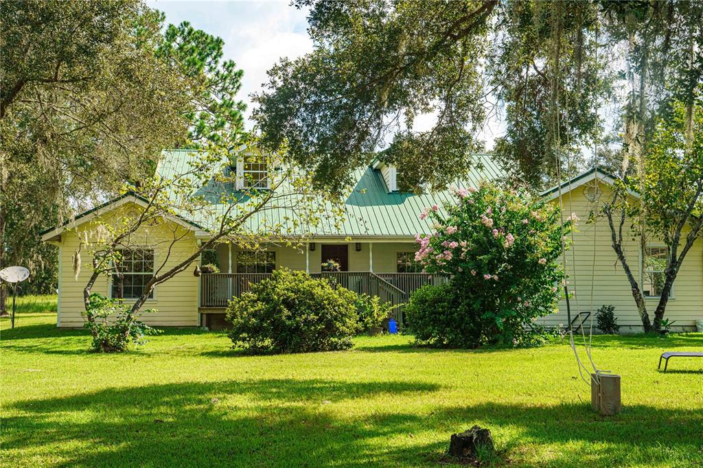 a view of a house with a garden