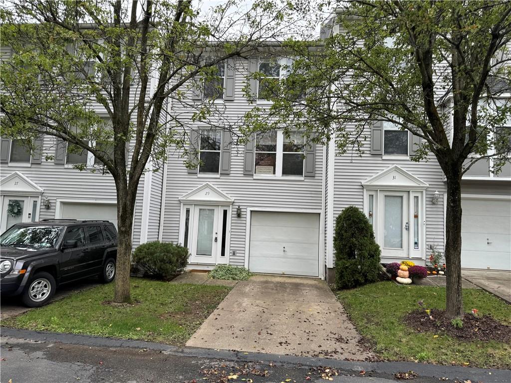 a view of a yard in front view of a house