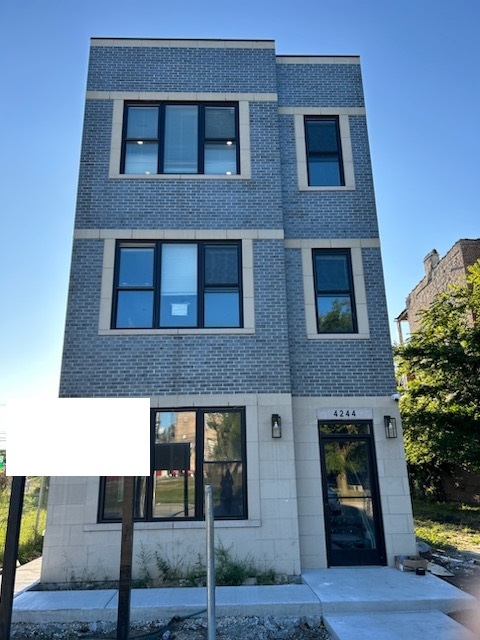 a black and white building with a outdoor space