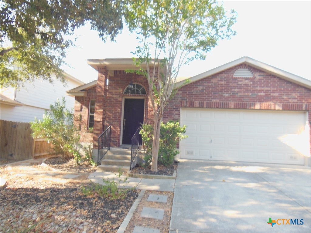 a front view of a house with yard