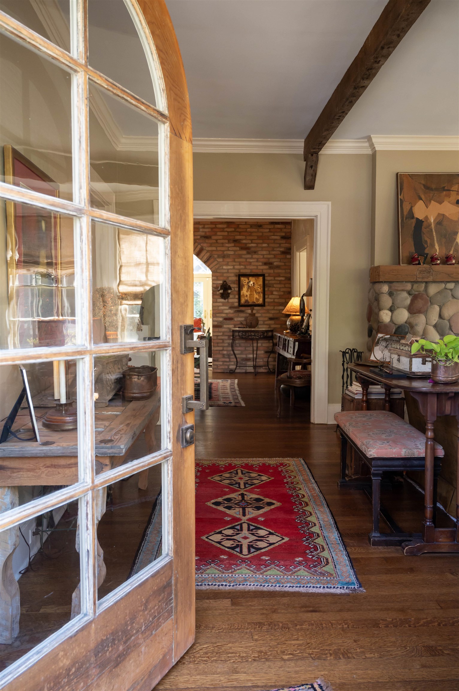 a living room with furniture lamp and rug