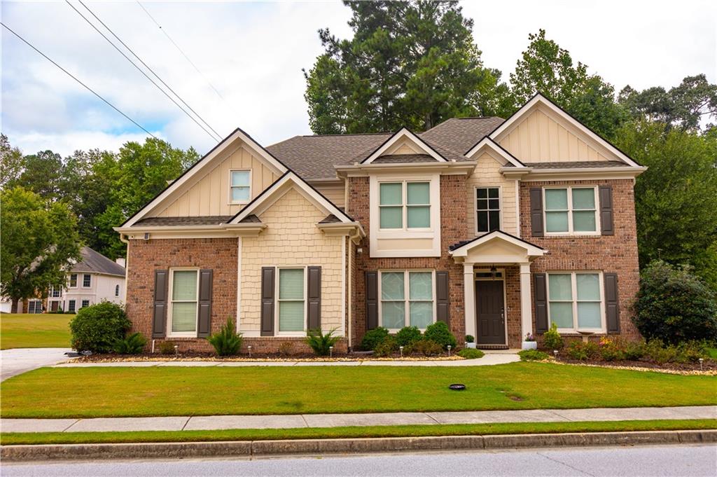 a front view of a house with a yard