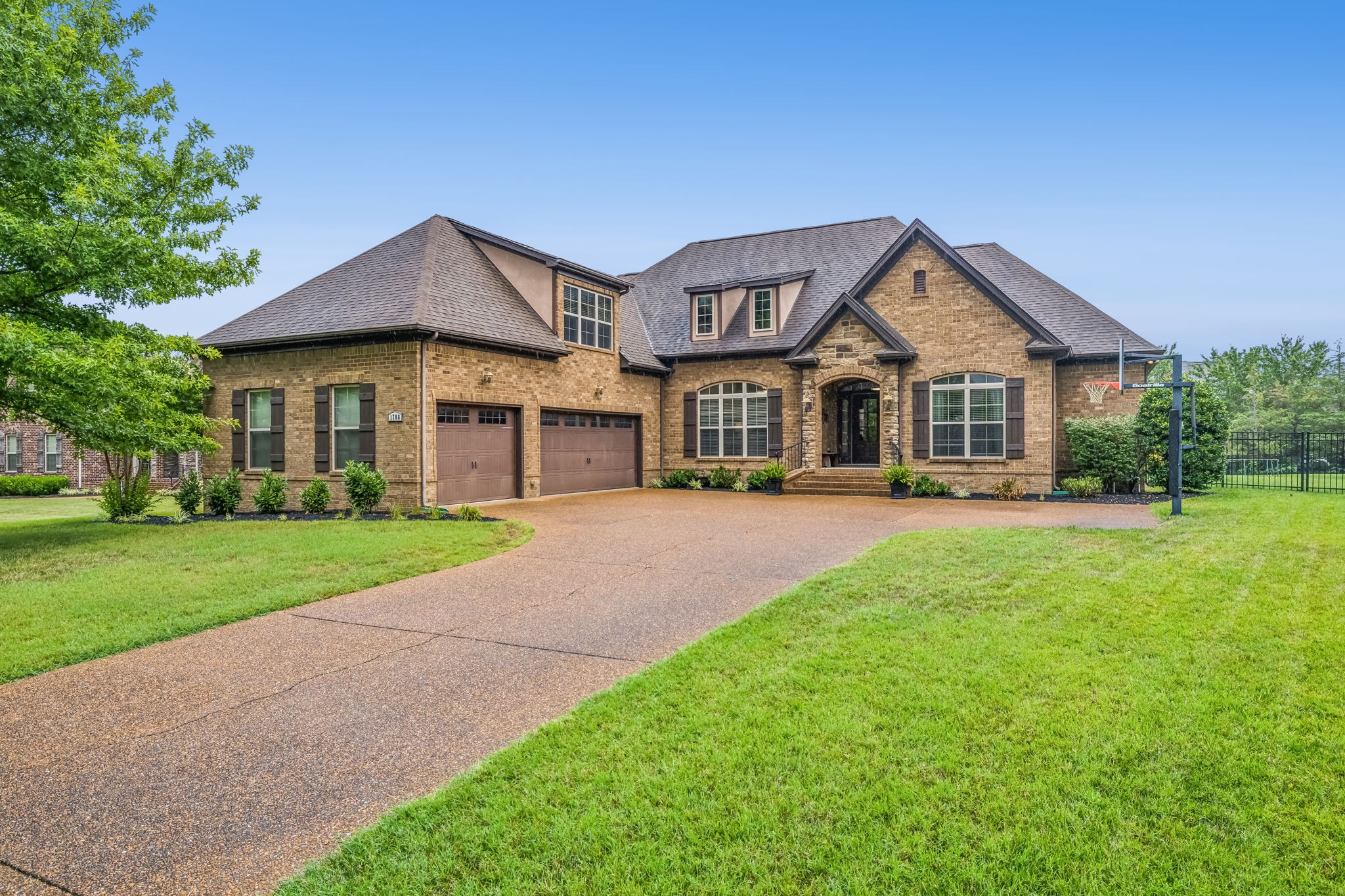 a front view of a house with a yard