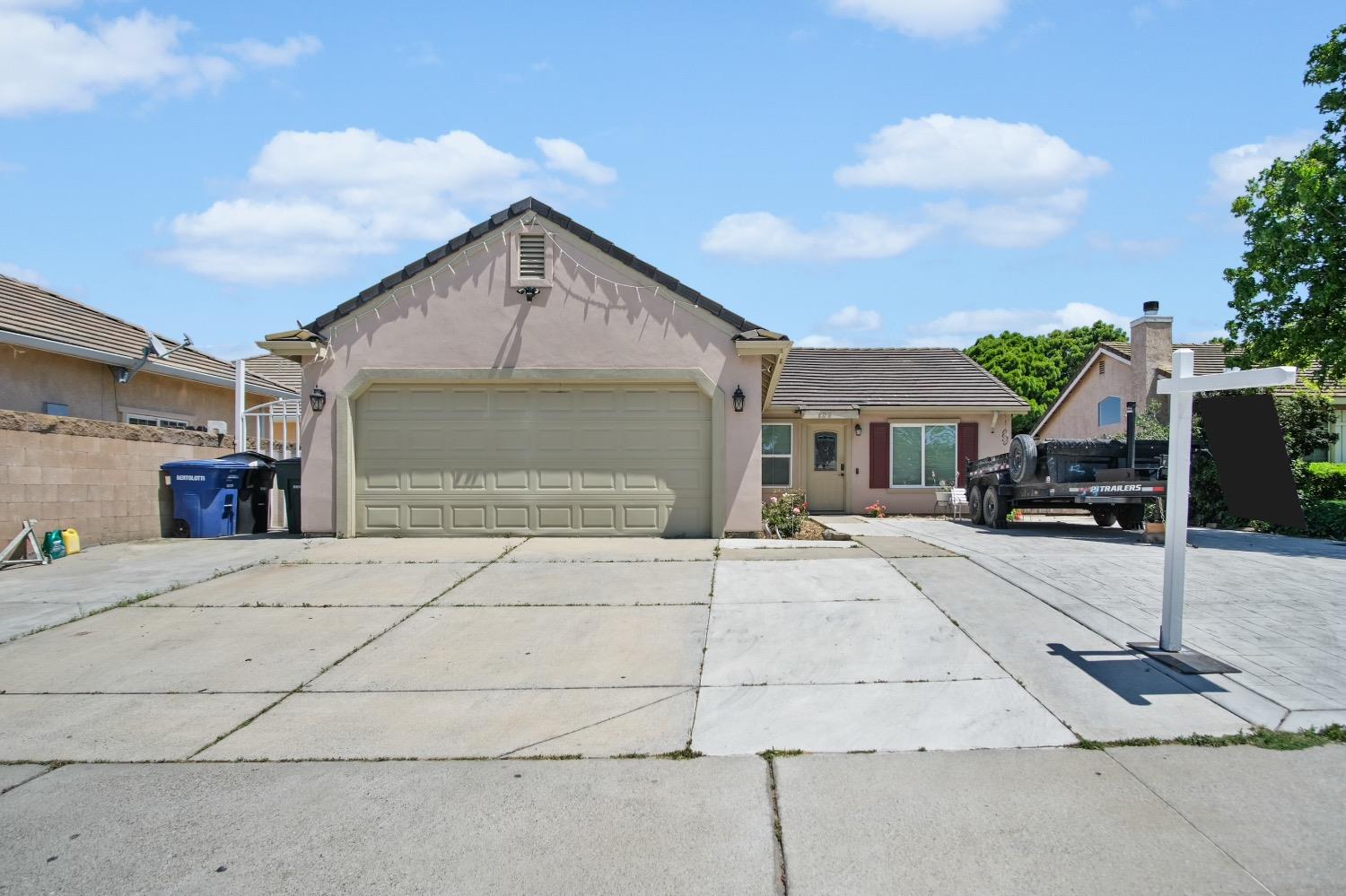 a front view of a house with a garage