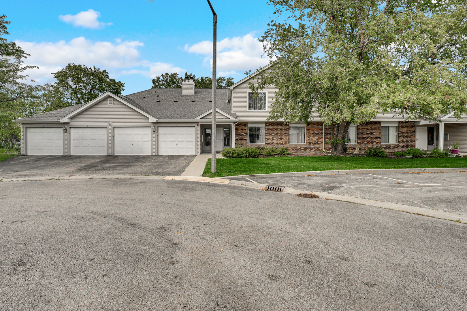 front view of a house next to a yard