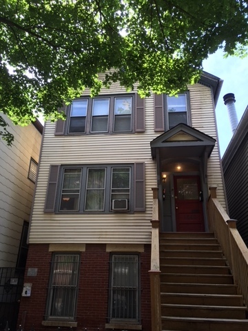 a front view of a house with a balcony