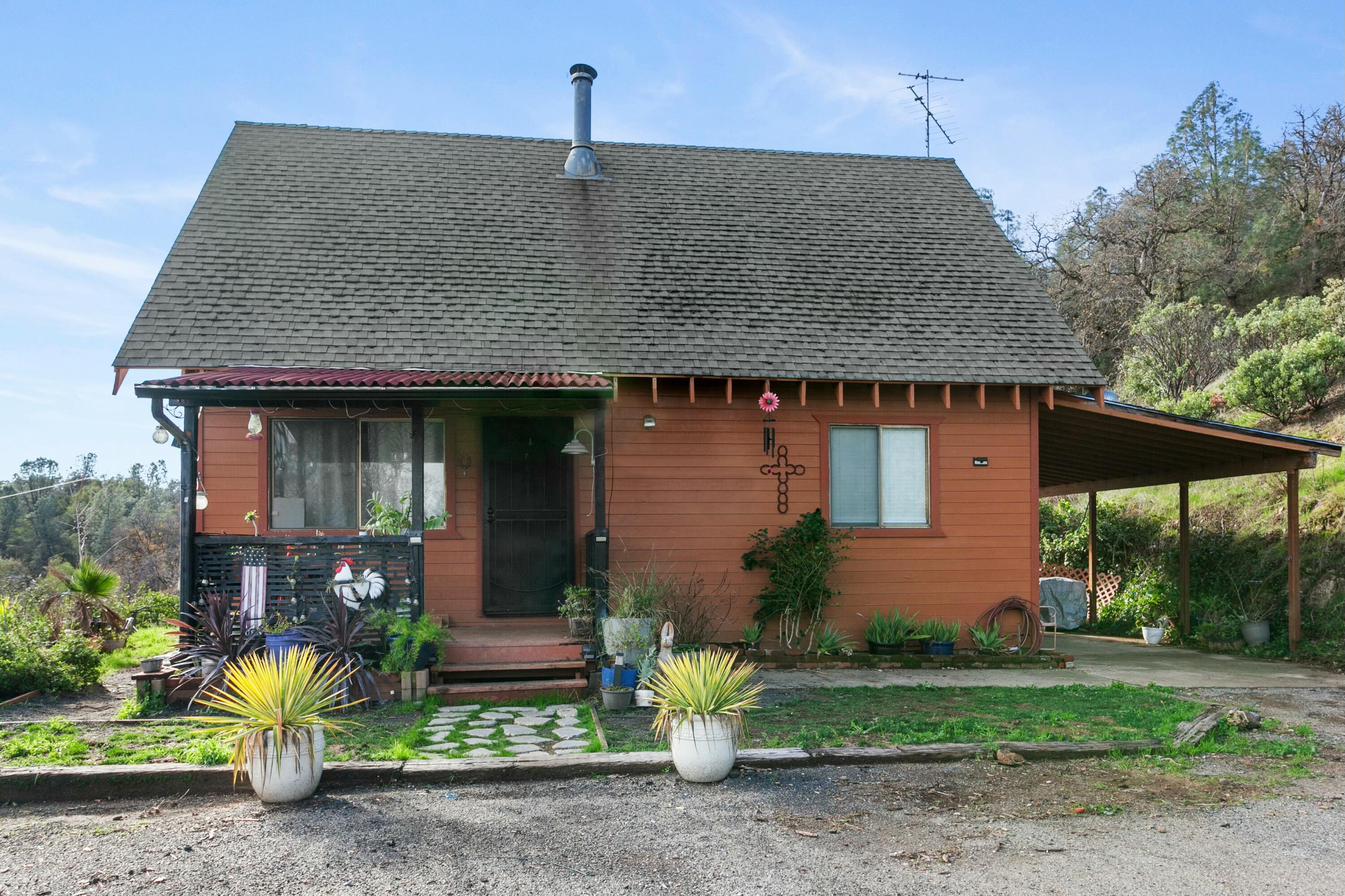 a front view of a house with garden