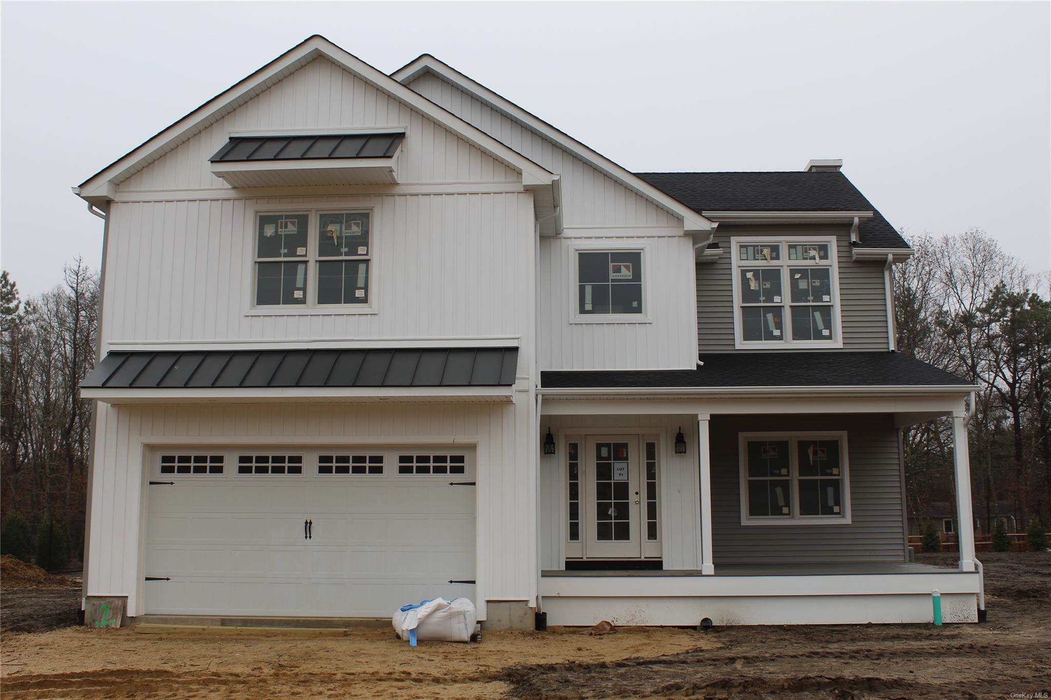 a front view of a house with a garage