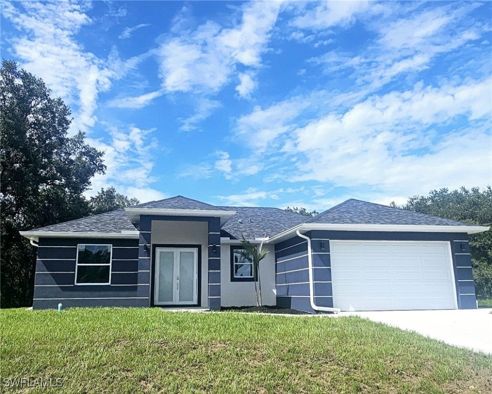 front view of a house with a yard